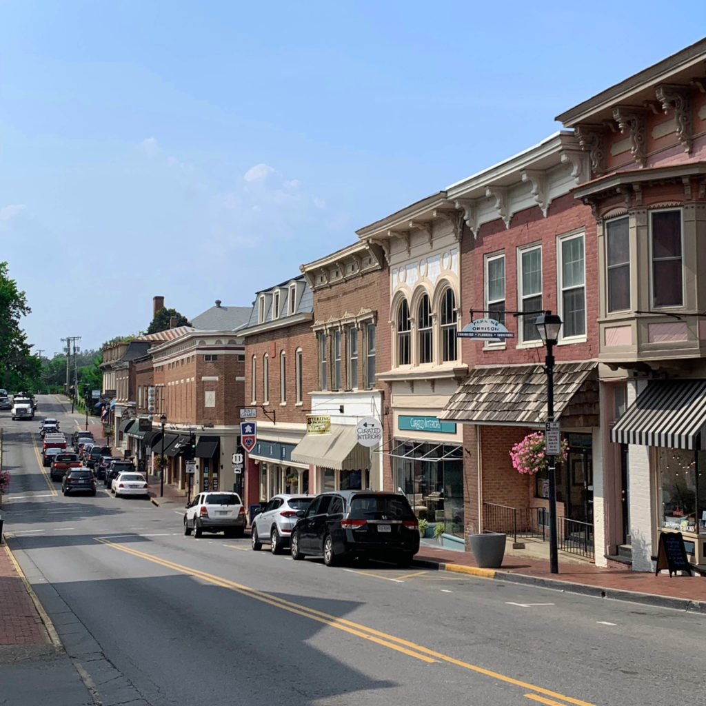 A view of one side of a West Nelson Street in downtown Lexington, Virginia, founded in 1778. There is no auto traffic and only a few parked cars can be seen.