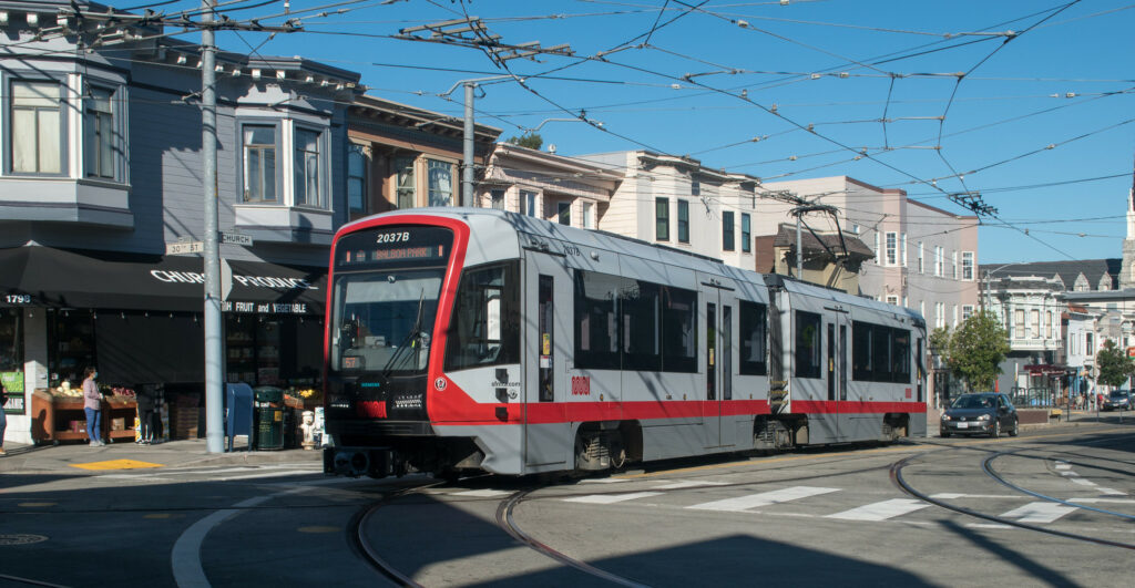 SF Muni electric trolley in Noe Valley at 30th and Church streets
