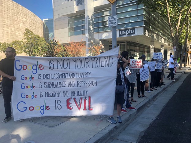 Protesters hold signs opposing Google at a rally before Diridon Station Area Plan advisory group meeting