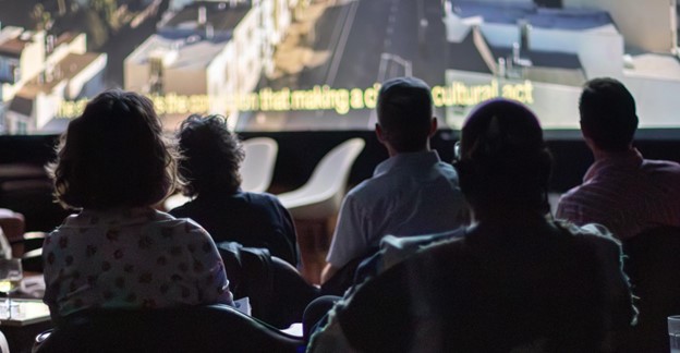 Participants view a film. Case studies are mixed media presentations at URBAN CO[LAB]