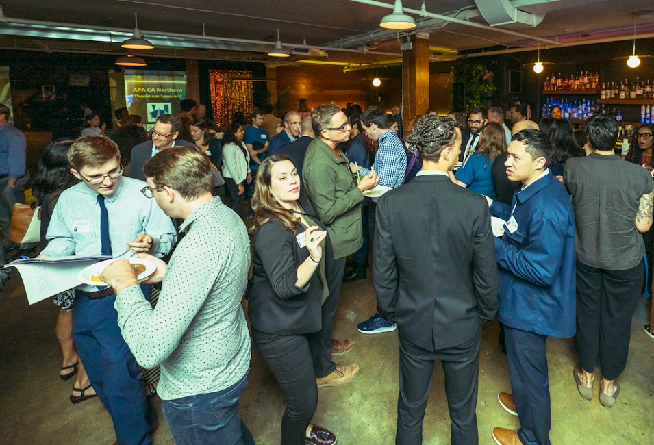 Photo of professional people networking at a bar