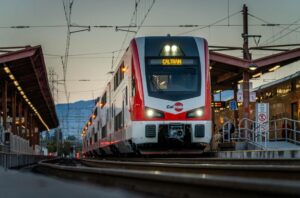 Photo of Diridian Station in San Jose, CA, showing a waiting train at the station.