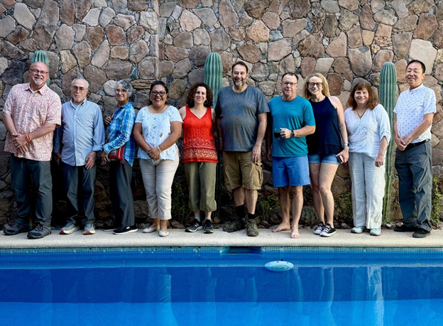 Group photo taken poolside in 