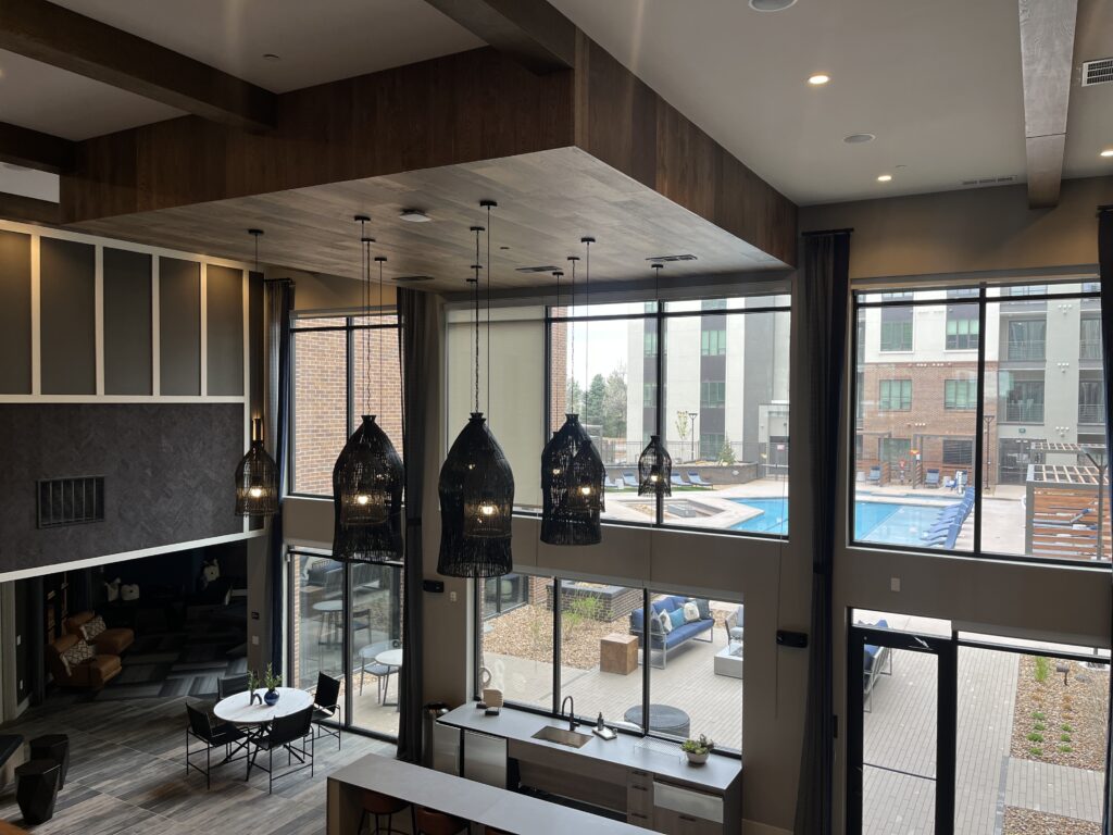 Hensley clubhouse Photograph from the inside of the clubhouse at the Hensley at the District apartment complex in Lone Tree, Colorado, looking into the interior courtyard.