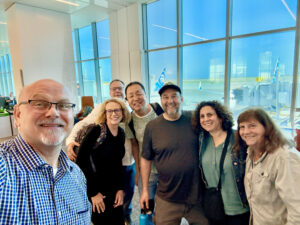 Photograph of a group of people at the San Francisco International Airport.