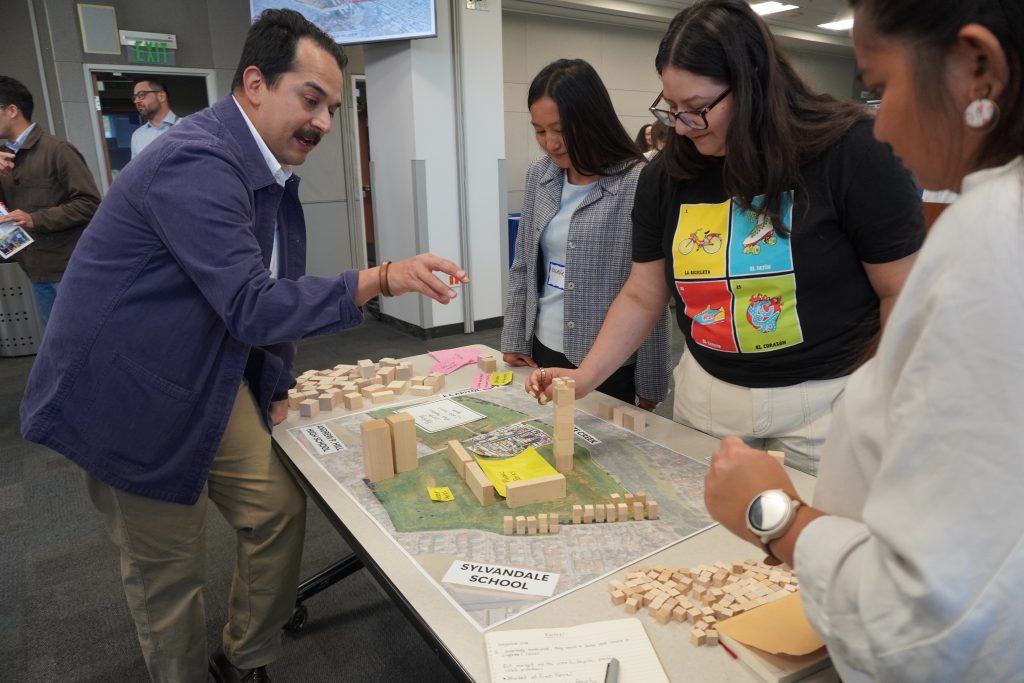 GalleryActivity Stakeholders designate land uses with wood blocks.